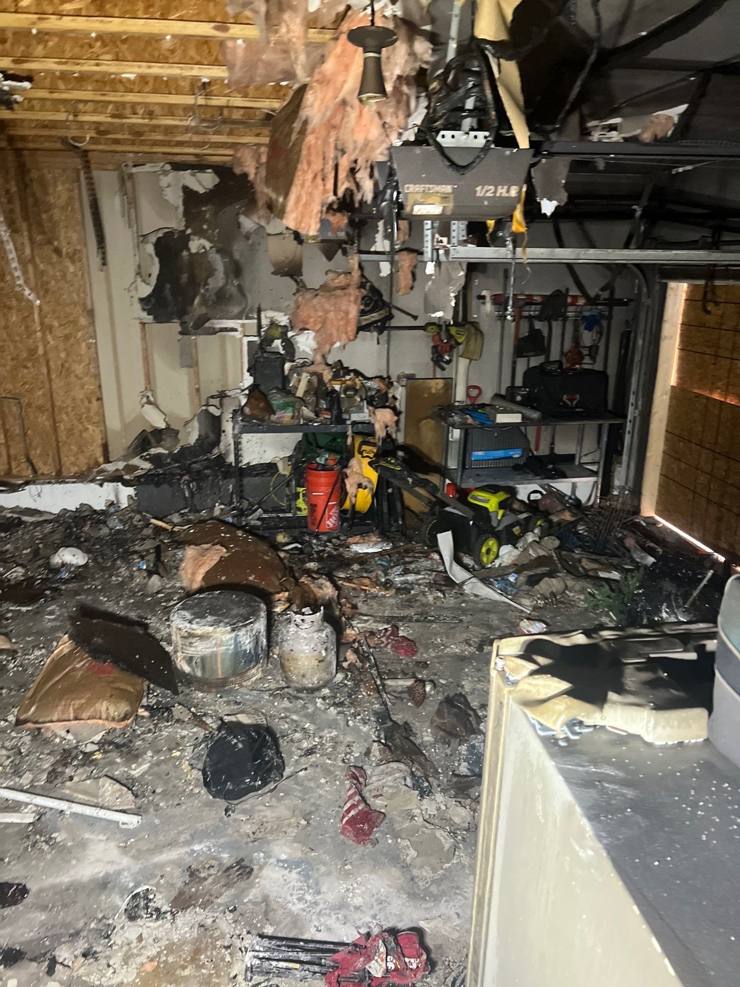 Extensive fire damage inside a Richmond garage cleared by IRS crew