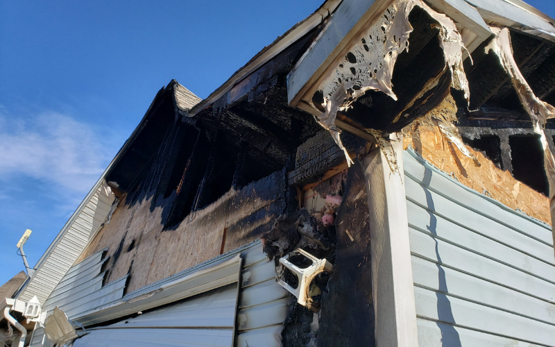 Exterior of a Richmond house with fire damage to roof and siding