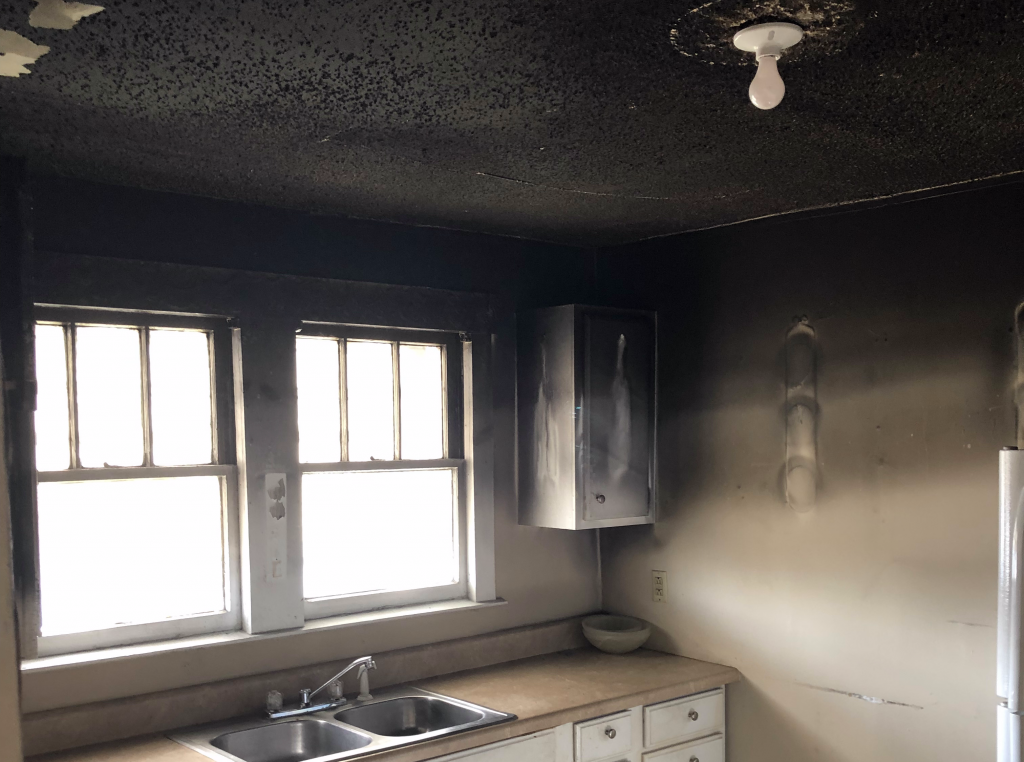 Heavy smoke and soot damage in a Richmond kitchen after a fire